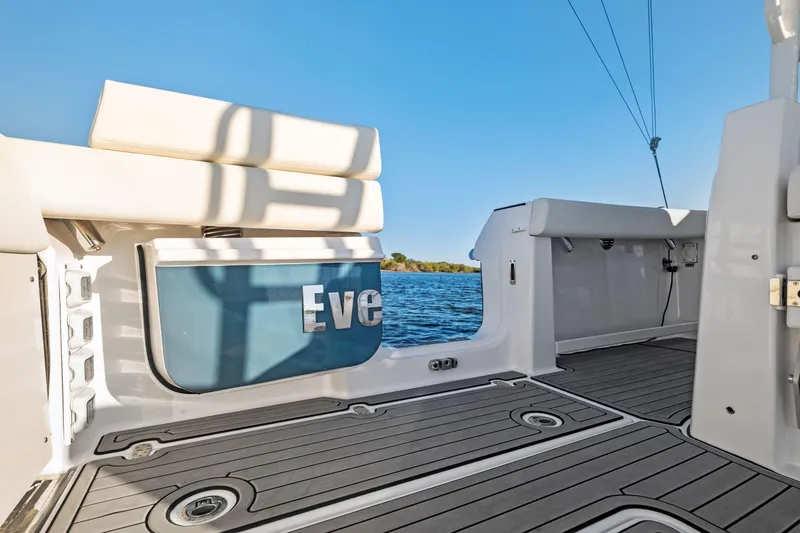 Slide: The Image of 2026 Everglades 375 Center Console boat interior with seating and ocean view. - 19
