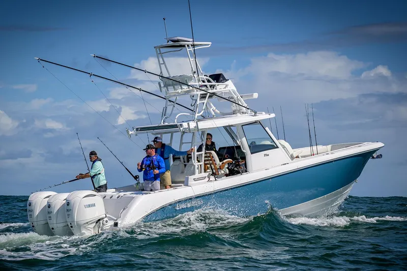 Slide: The Image of Manufacturer Provided Image: 2025 Everglades 375 Center Console boat cruising with anglers on board. - 2
