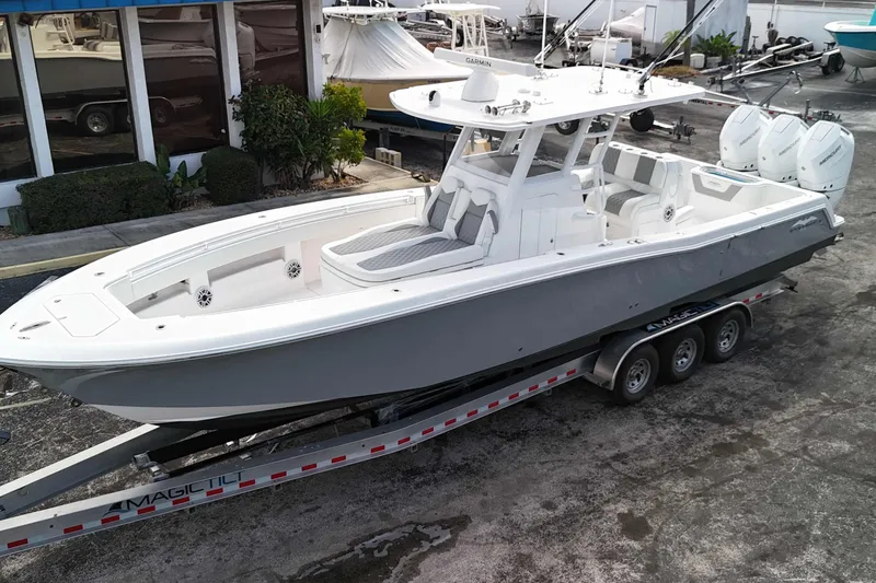 Slide: The Image of 2025 Invincible 36 Open Fisherman boat on trailer, parked outdoors. - 1