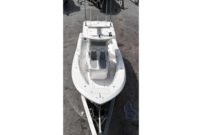 Slide: The Image of 2025 Invincible 36 Open Fisherman boat, aerial view, sleek design, white exterior. - 13