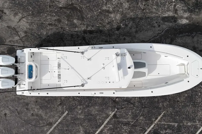 Slide: The Image of Overhead view of 2025 Invincible 36 Open Fisherman boat with triple engines. - 14