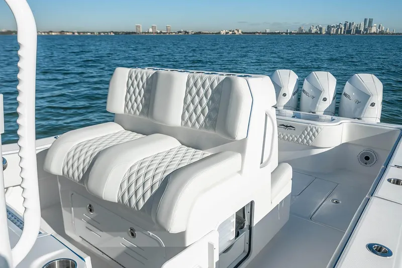 Slide: The Image of Manufacturer Provided Image: 2025 Invincible 36 Open Fisherman boat with luxurious seating on a calm ocean backdrop. - 3