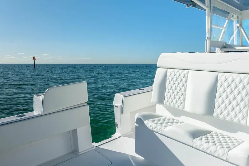 Slide: The Image of Manufacturer Provided Image: 2025 Invincible 36 Open Fisherman boat with white seating, ocean view. - 6