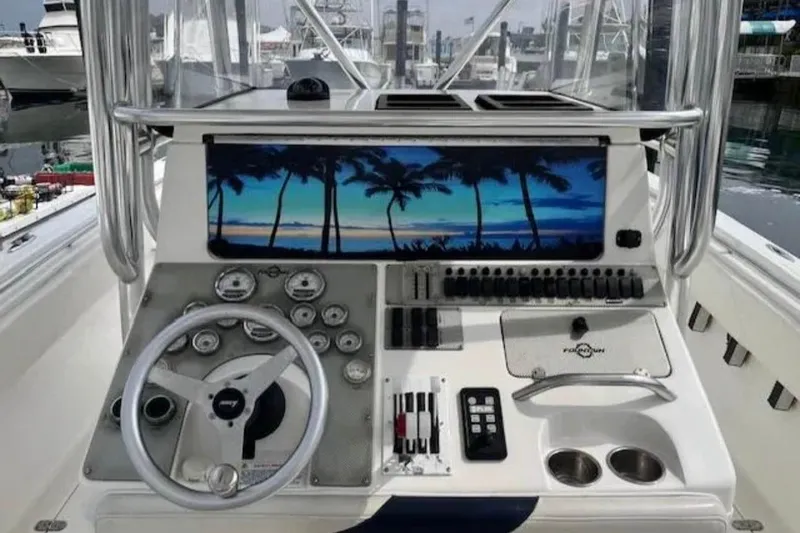 Slide: The Image of 2008 Fountain 34 Center Console boat dashboard with tropical screen display. - 2