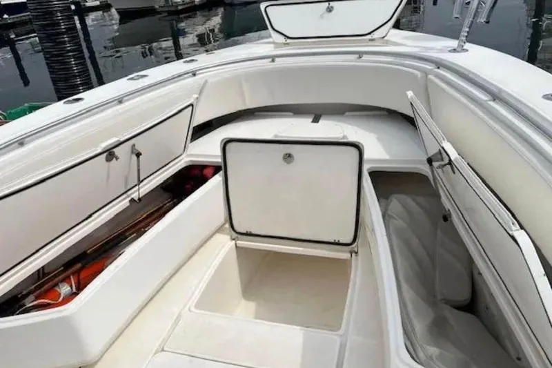 Slide: The Image of 2008 Fountain 34 Center Console boat with open storage compartments at the bow. - 4