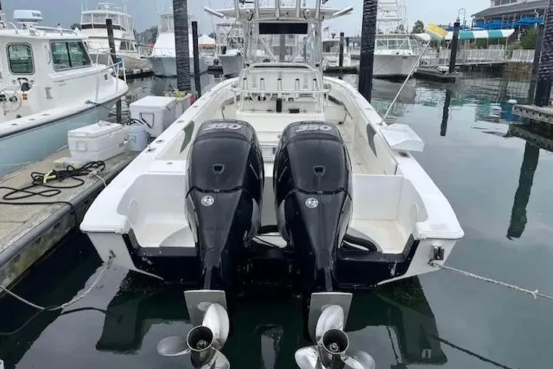 Slide: The Image of 2008 Fountain 34 Center Console boat with twin engines docked at marina. - 7