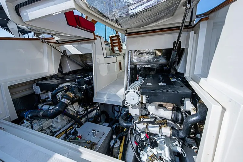 Slide: The Image of Engine compartment of a 2016 Hinckley Talaria 34 boat, showcasing dual engines. - 20
