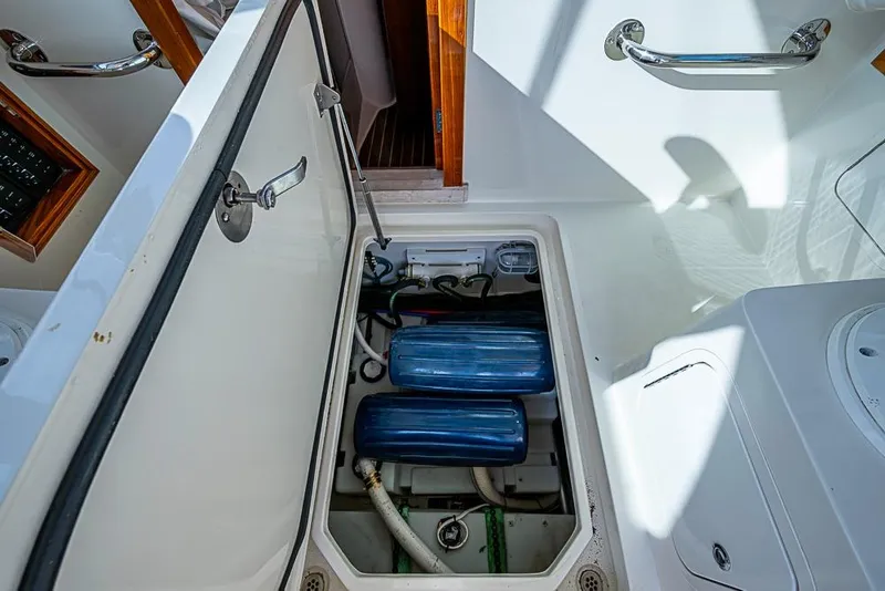 Slide: The Image of Open engine compartment of 2016 Hinckley Talaria 34 boat, showcasing internal components. - 21
