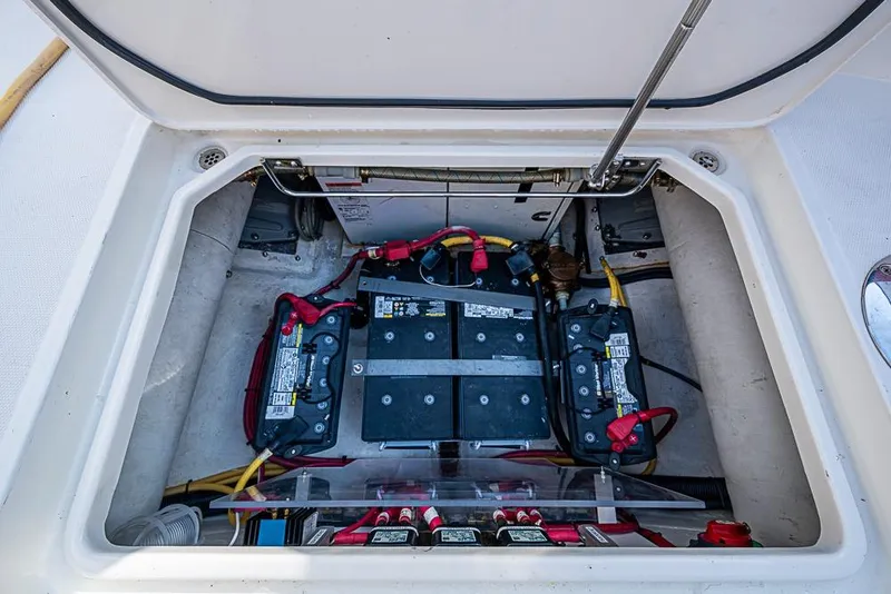Slide: The Image of Battery compartment of a 2016 Hinckley Talaria 34 boat, showing multiple batteries and wiring. - 22
