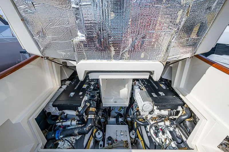 Slide: The Image of Engine compartment of a 2016 Hinckley Talaria 34 boat, showcasing dual engines. - 23