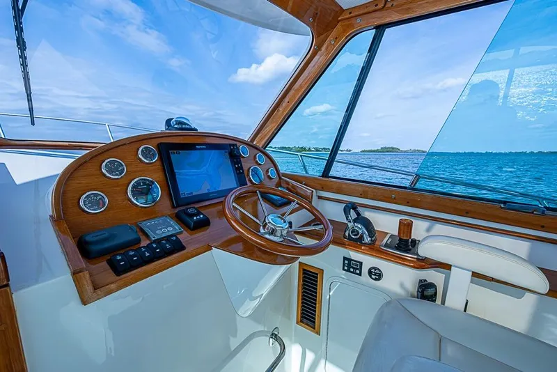 Slide: The Image of Helm of 2016 Hinckley Talaria 34 yacht with ocean view and navigation instruments. - 9