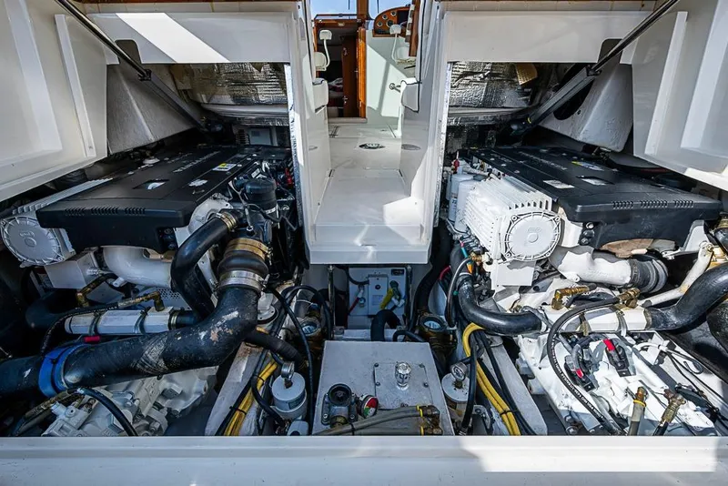 Slide: The Image of Engine room of a 2016 Hinckley Talaria 34 boat, showcasing dual engines. - 19