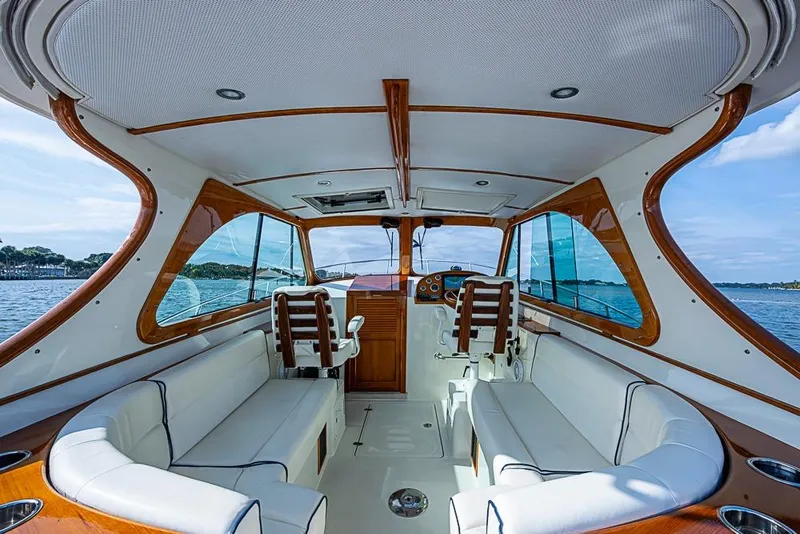 Slide: The Image of Interior of 2016 Hinckley Talaria 34 yacht with elegant seating and wooden accents. - 8