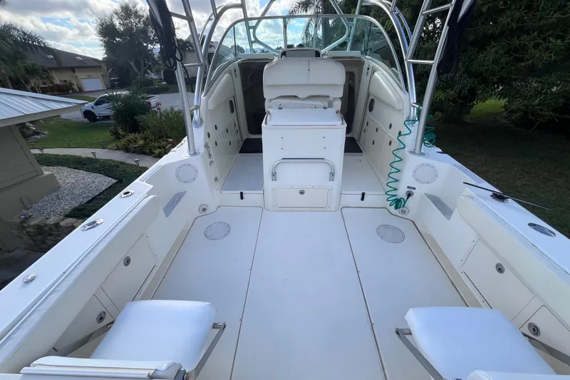 Slide: The Image of 2010 World Cat 290 EC boat interior with spacious deck and seating. - 11