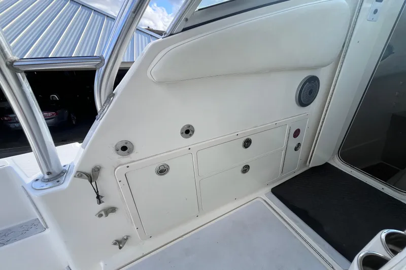 Slide: The Image of 2010 World Cat 290 EC boat interior with storage compartments and speaker. - 16