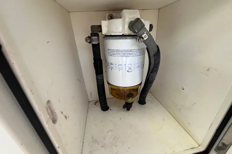 Slide: The Image of Fuel filter system inside a 2010 World Cat 290 EC boat compartment. - 36