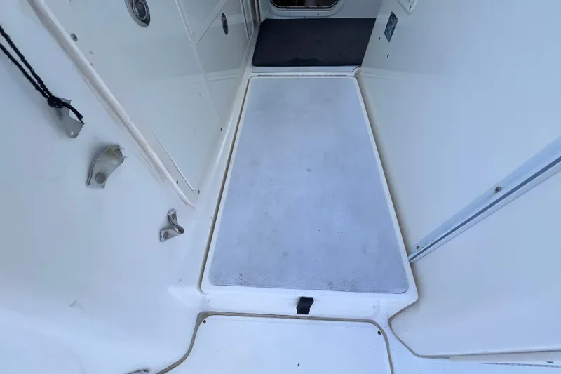 Slide: The Image of 2010 World Cat 290 EC boat interior deck with clean white surface. - 42