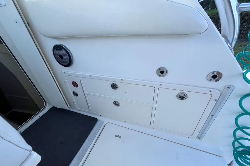 Slide: The Image of 2010 World Cat 290 EC boat interior with storage compartments and speaker. - 50