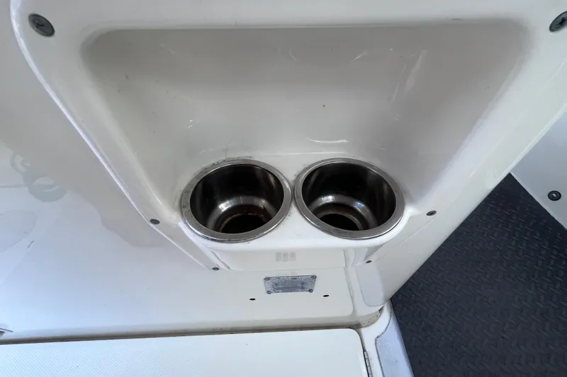 Slide: The Image of Cup holders on a 2010 World Cat 290 EC boat interior. - 51