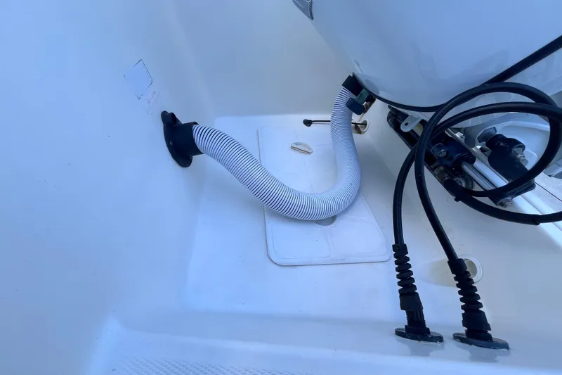Slide: The Image of 2010 World Cat 290 EC boat interior with hoses and cables. - 59