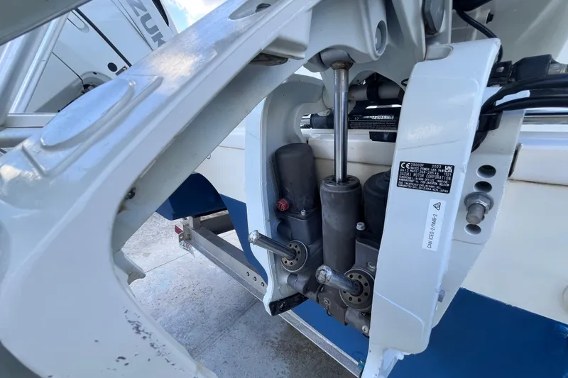 Slide: The Image of Close-up of a 2010 World Cat 290 EC boat engine components and hydraulic system. - 69