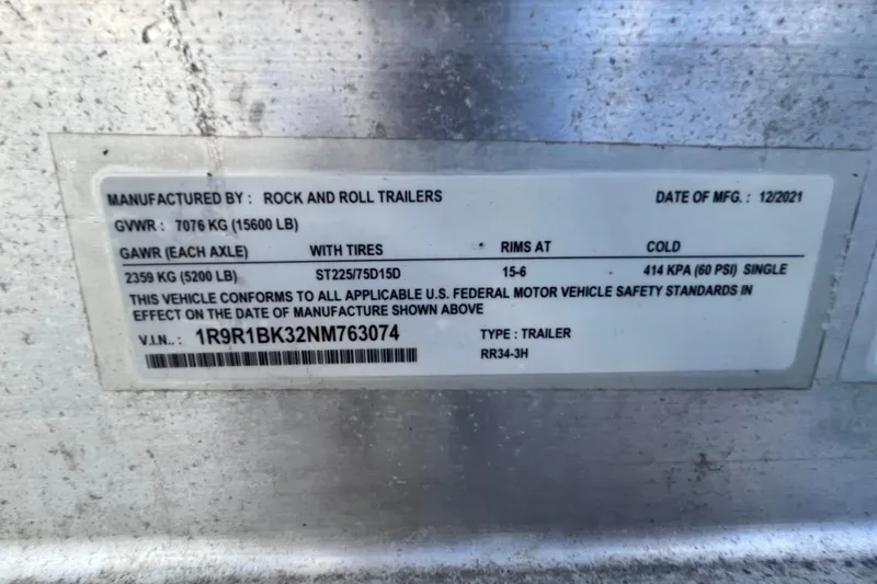 Slide: The Image of Trailer label by Rock and Roll Trailers, manufactured 12/2021, showing specifications and compliance details. - 79