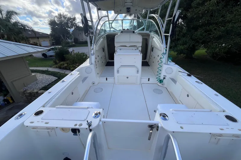 Slide: The Image of 2010 World Cat 290 EC boat interior with spacious deck and seating. - 9