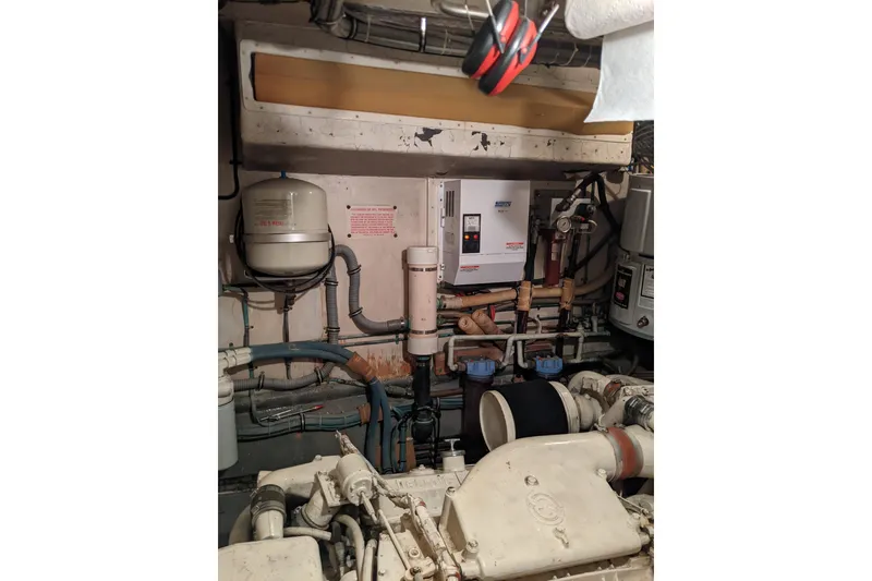 Slide: The Image of Engine room of 1984 Hatteras 53 Extended Deckhouse Motor Yacht with mechanical components. - 11
