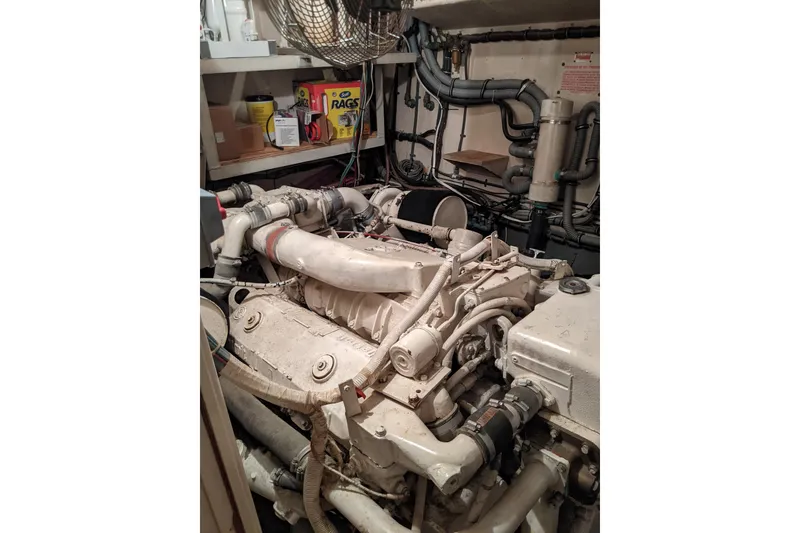 Slide: The Image of Engine room of 1984 Hatteras 53 Extended Deckhouse Motor Yacht, showcasing mechanical components. - 14