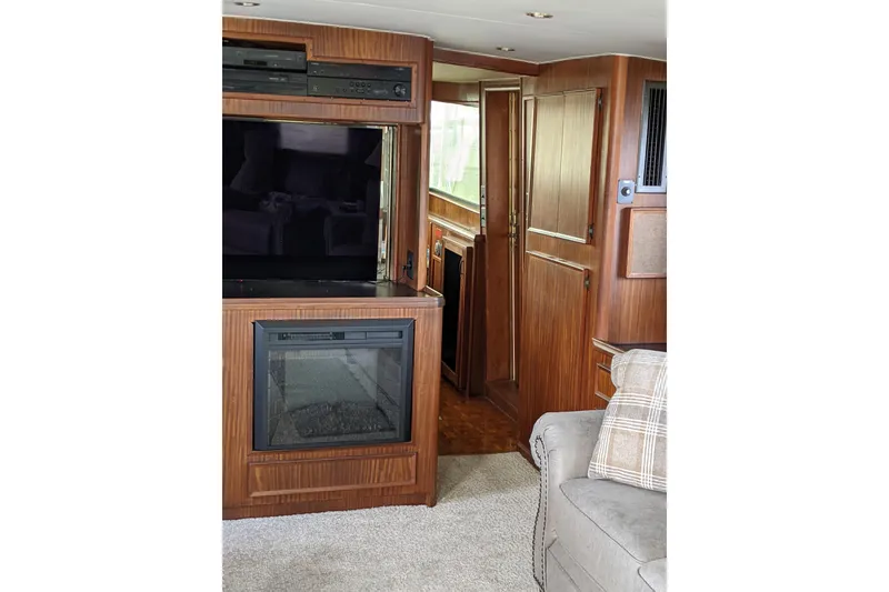 Slide: The Image of Interior of 1984 Hatteras 53 Motor Yacht with wood paneling and modern amenities. - 30