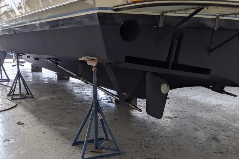 Slide: The Image of 1984 Hatteras 53 Extended Deckhouse Motor Yacht on stands in a workshop. - 48