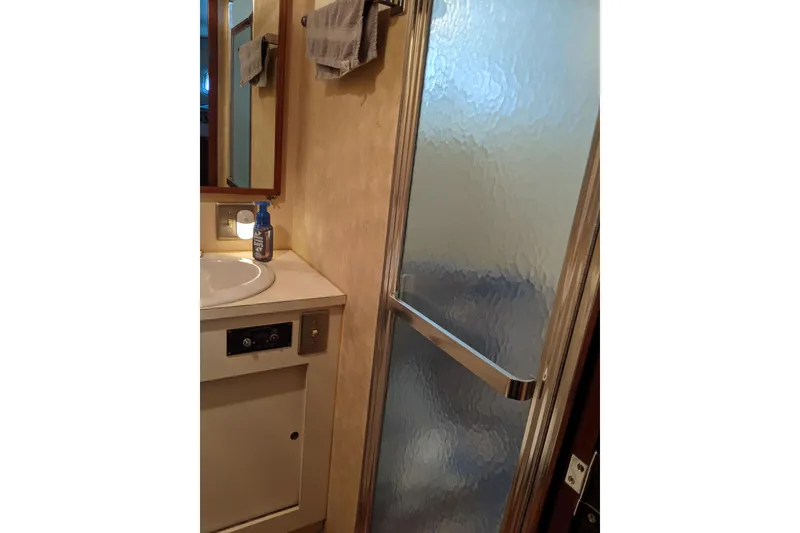 Slide: The Image of Bathroom interior of 1984 Hatteras 53 Extended Deckhouse Motor Yacht with shower and sink. - 58