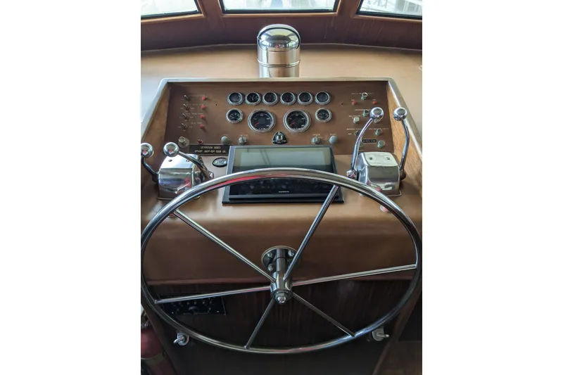 Slide: The Image of Interior of 1984 Hatteras 53 Motor Yacht with dining area and wooden cabinetry. - 63