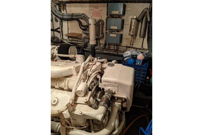 Slide: The Image of Engine room of 1984 Hatteras 53 Extended Deckhouse Motor Yacht, showing machinery and equipment. - 72