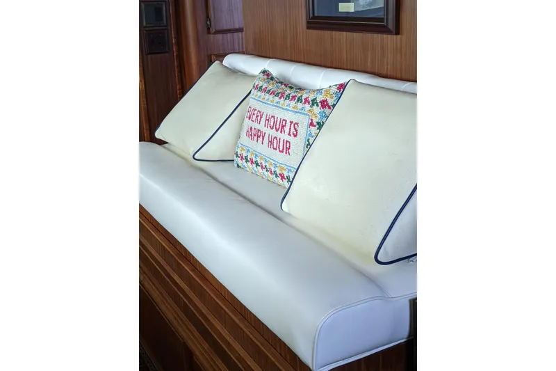 Slide: The Image of Luxurious seating on 1984 Hatteras 53 Motor Yacht with decorative pillow, "Every Hour is Happy Hour." - 9