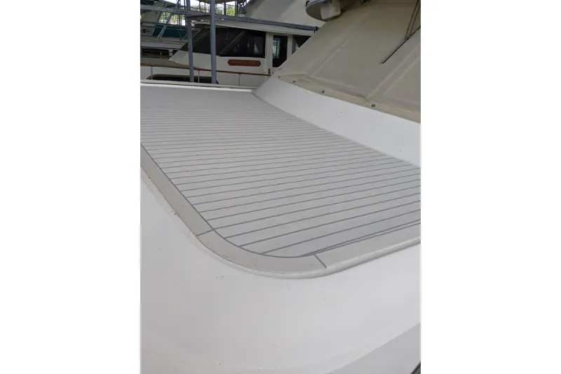 Slide: The Image of 1984 Hatteras 53 Extended Deckhouse Motor Yacht deck, showcasing sleek design and spacious layout. - 92