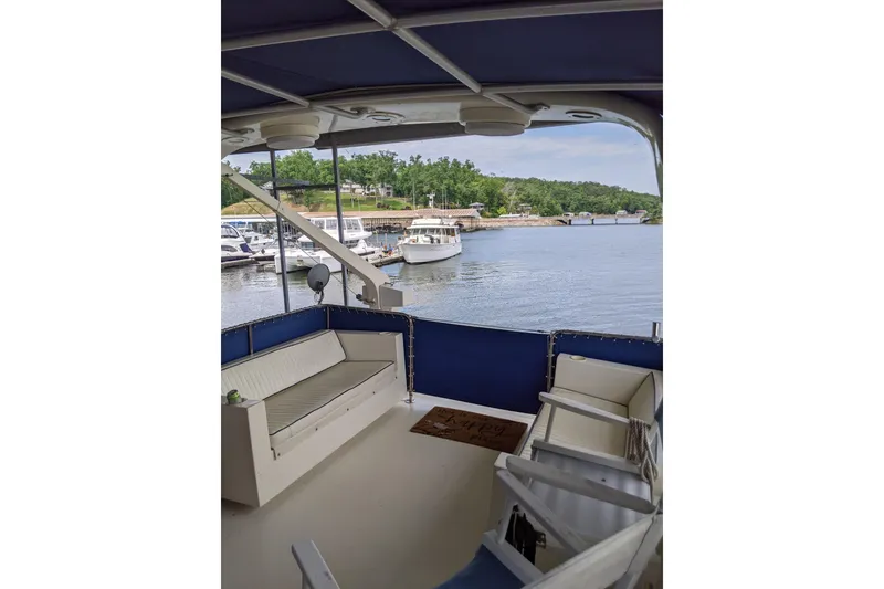 Slide: The Image of 1984 Hatteras 53 Extended Deckhouse Motor Yacht with spacious deck overlooking marina. - 98