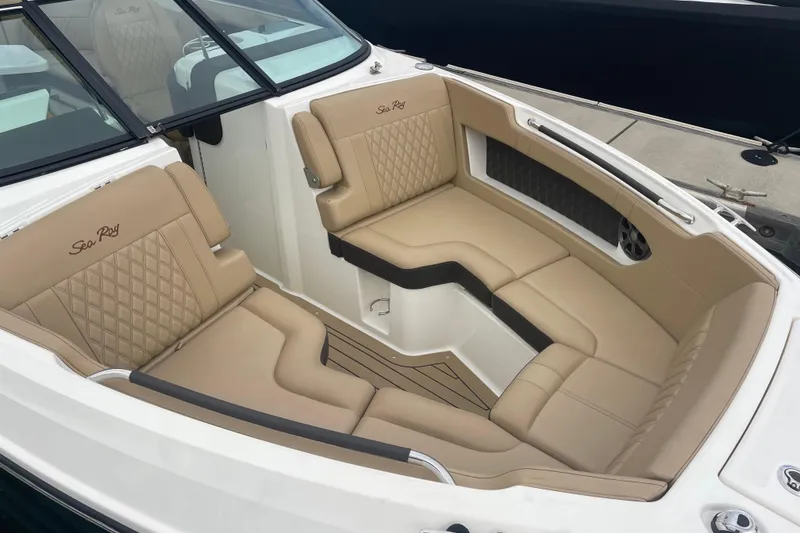 Slide: The Image of Luxurious seating in 2021 Sea Ray SLX 250 boat, featuring tan upholstery and elegant design. - 2