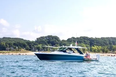 The Image of 2026 Tiara Yachts 39 LS cruising on open water, showcasing sleek design and luxury. - 0