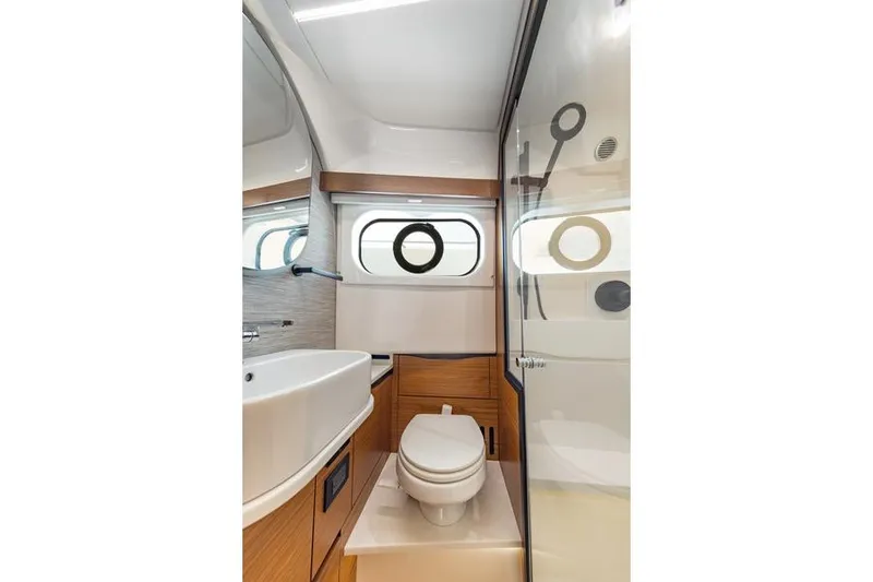 Slide: The Image of Luxury seating on 2026 Tiara Yachts 39 LS, featuring elegant design and integrated cup holders. - 10