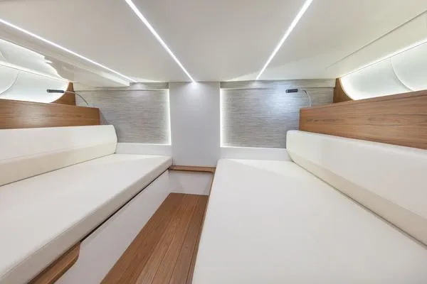 Slide: The Image of 2026 Tiara Yachts 39 LS storage compartment with fire extinguisher, open on deck. - 11