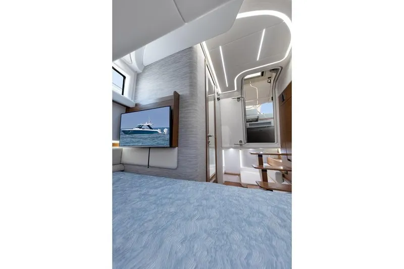 Slide: The Image of 2026 Tiara Yachts 39 LS interior with open storage compartments and seating. - 13