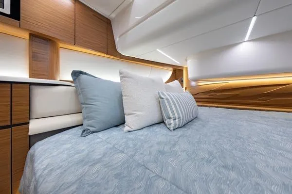 Slide: The Image of Luxurious seating area on 2026 Tiara Yachts 39 LS with elegant wood table. - 14