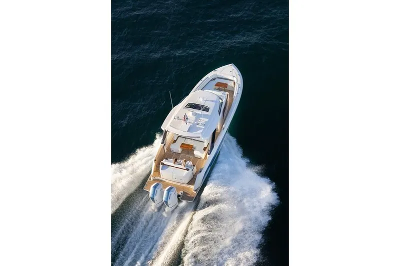 Slide: The Image of 2026 Tiara Yachts 39 LS boat storage compartment with open hatch and sleek interior design. - 16