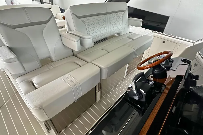 Slide: The Image of 2026 Tiara Yachts 39 LS interior with luxurious seating and modern helm controls. - 22