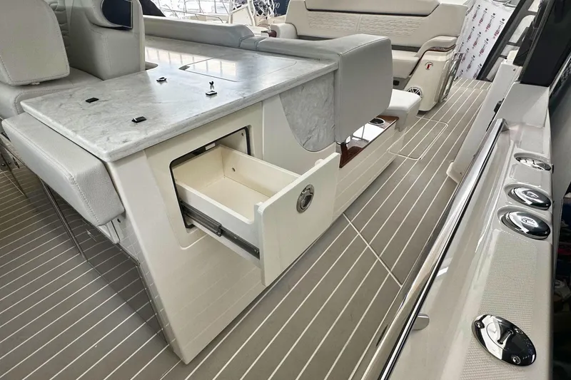 Slide: The Image of Interior of 2026 Tiara Yachts 39 LS with sleek seating and storage drawer. - 23
