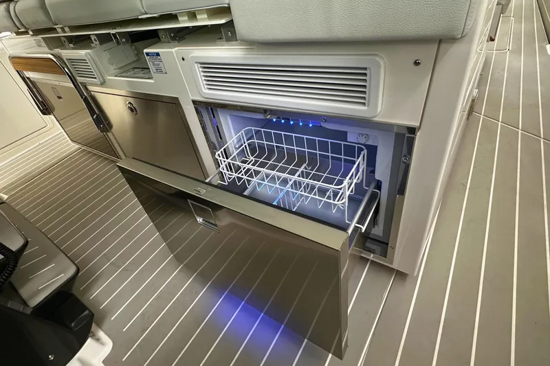 Slide: The Image of Interior of 2026 Tiara Yachts 39 LS featuring a modern drawer refrigerator. - 24