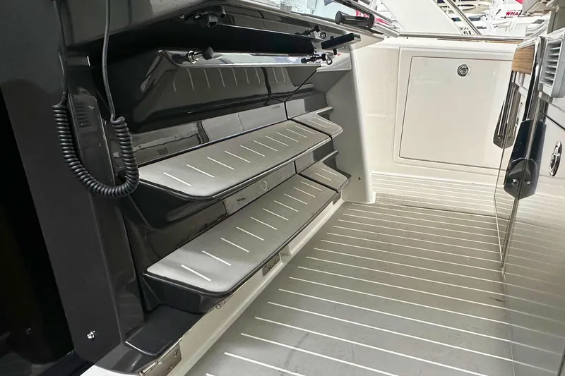 Slide: The Image of 2026 Tiara Yachts 39 LS interior with sleek, modern design and foldable steps. - 26