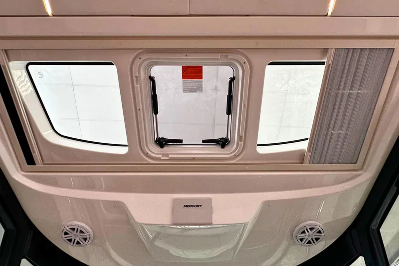 Slide: The Image of Interior view of 2026 Tiara Yachts 39 LS, featuring a sunroof and ventilation system. - 30