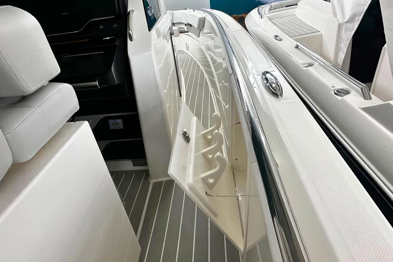 Slide: The Image of 2026 Tiara Yachts 39 LS interior with sleek white seating and modern design. - 33